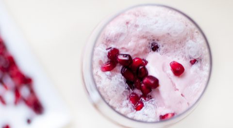 Strawberry champagne floats with pomegrante seeds